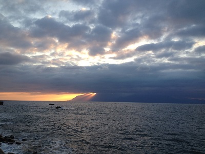 Sunset Behind Yakushima With Sun Rays Through Clouds
